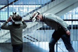 man and boy with VR headsets